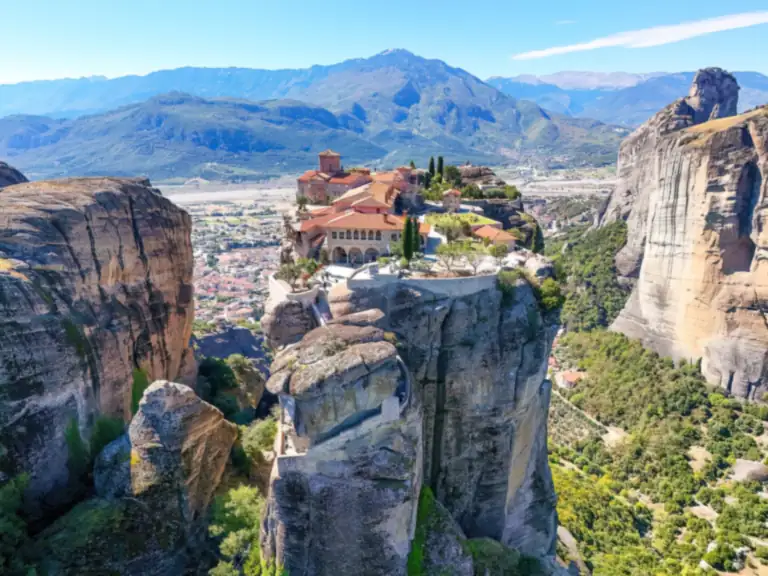 The monastery of the Holy Trinity on its rock at Meteora, with the plain of Thessaly behind.