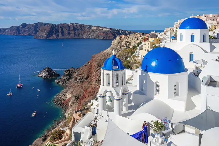 The blue domes of Oia above the caldera of Santorini.